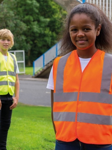 School wear hi vis vest for enhanced visibility safety worn over school uniform
